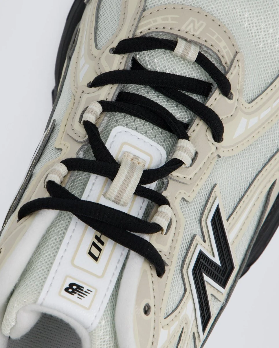 New Balance U7404OO Beiges y Negras Hombre - Image 2